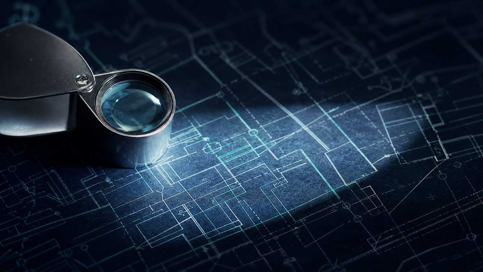 Jeweller's loupe over a technical diagram